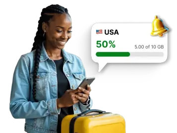 Voyageur vérifiant l’utilisation des données mobiles pour les États-Unis dans une application, avec une notification indiquant que 50 % du forfait de 10 Go a été utilisé.