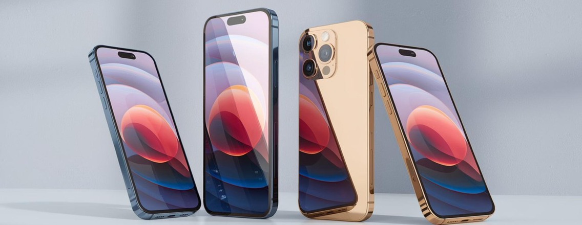 Four modern smartphones standing upright in a row, including gold and dark-colored models with vibrant, abstract wallpapers displayed on their screens.